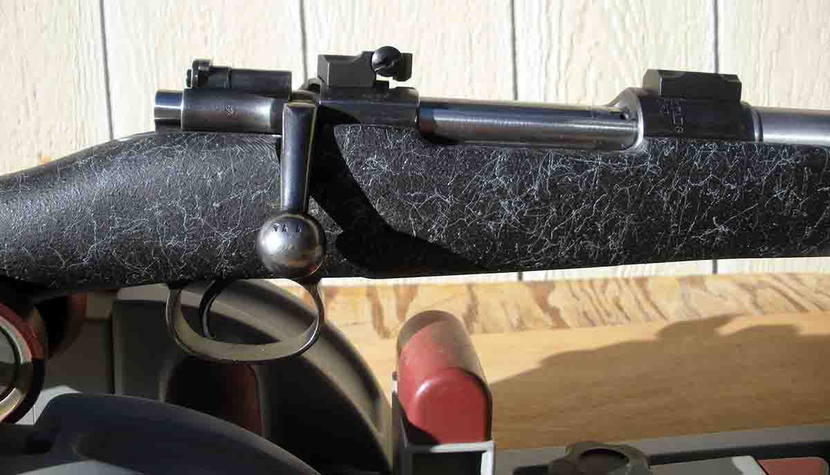 A view of the Model 96 Mauser action shows the striker for the cock-on-opening conversion with a Dayton Traister trigger, and contoured rear receiver ring to accommodate the Leupold-type rear scope base.